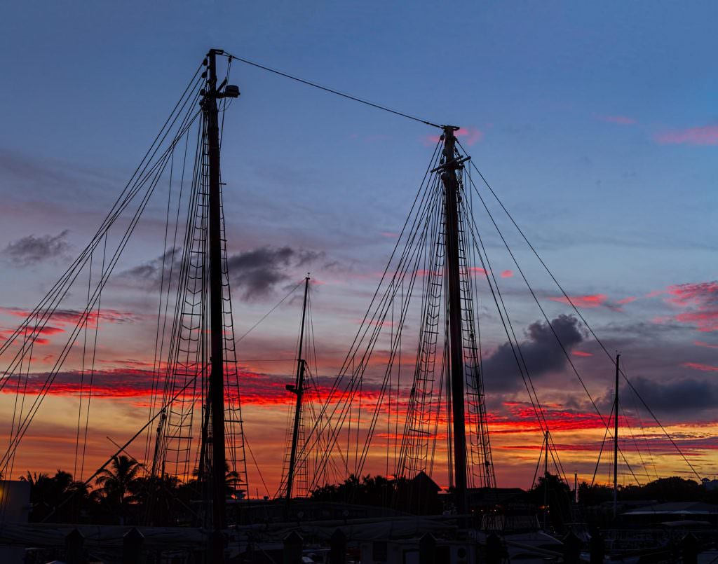 Beautiful sunset in Key West Florida as seen through the rigging of a twin mast sailing ship