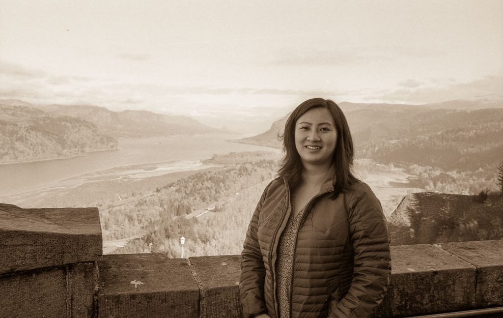 Young woman looks out over columbia river